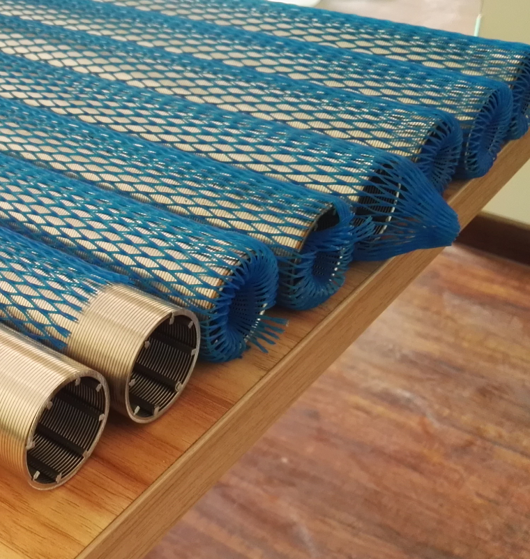 There are eight wedge wire filters on the desk, and seven of then are wrapped by blue plastic mesh.